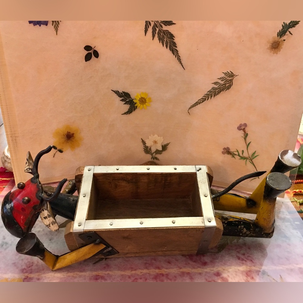 Rustic Wooden Bull Planter with Vibrant Accents